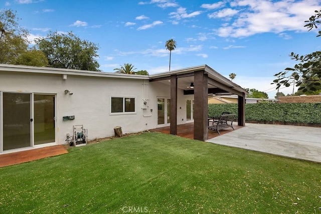 18720 Keswick St, Reseda, CA 91335 - back of house featuring stucco siding, ceiling fan, and a patio