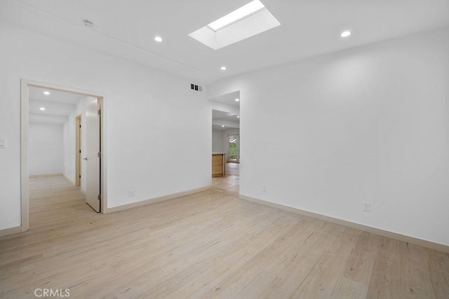 18720 Keswick St, Reseda, CA 91335 - spare room featuring recessed lighting, a skylight, and light wood finished floors
