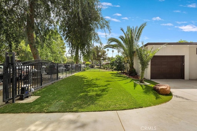 18720 Keswick St, Reseda, CA 91335 - view of yard featuring a garage and concrete driveway