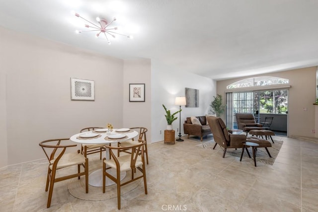 3284 Barham Blvd Unit 201, Los Angeles, CA 90068 - dining area featuring a chandelier and light tile patterned floors
