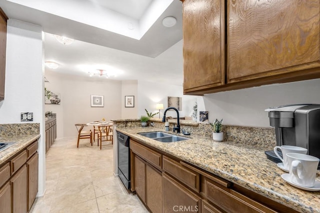 3284 Barham Blvd Unit 201, Los Angeles, CA 90068 - kitchen featuring dishwasher, light stone counters, light tile patterned flooring, a peninsula, and a skylight
