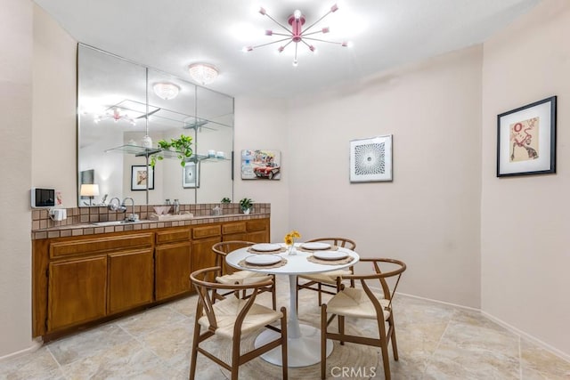 3284 Barham Blvd Unit 201, Los Angeles, CA 90068 - dining area with a chandelier and baseboards