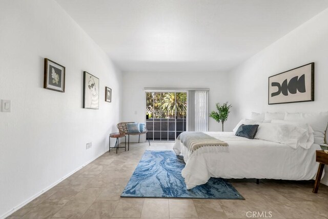 3284 Barham Blvd Unit 201, Los Angeles, CA 90068 - tiled bedroom with access to outside