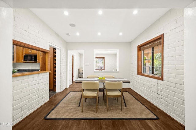 5245 Ramsdell Ave, La Crescenta, CA 91214 - dining area featuring dark wood-style floors, brick wall, plenty of natural light, and recessed lighting