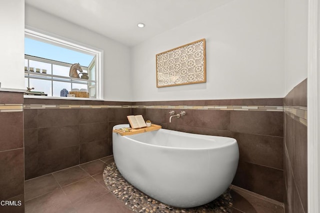 5245 Ramsdell Ave, La Crescenta, CA 91214 - full bath featuring tile walls, a wainscoted wall, tile patterned flooring, and a soaking tub