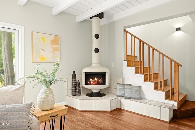 5245 Ramsdell Ave, La Crescenta, CA 91214 - living area with wood finished floors, beam ceiling, a wood stove, and stairs