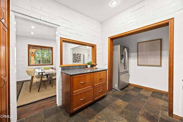 5245 Ramsdell Ave, La Crescenta, CA 91214 - bar area with stainless steel fridge, brick wall, dark stone finish floors, and recessed lighting