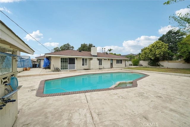 1346 Butler Way, Upland, CA 91786 - view of swimming pool featuring a patio, a fenced backyard, and a pool with connected hot tub