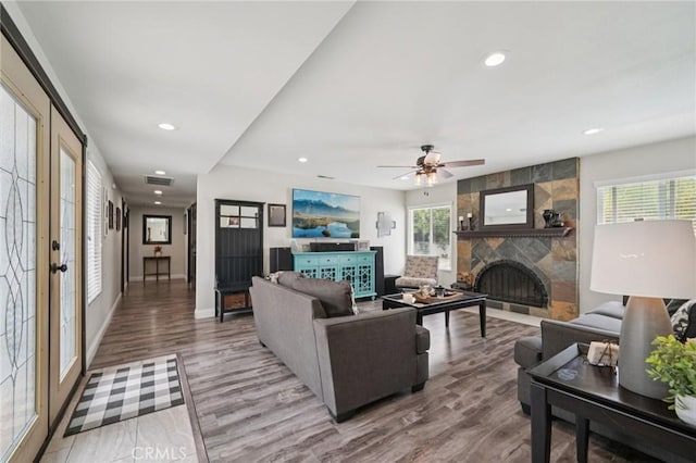 1346 Butler Way, Upland, CA 91786 - living area featuring light wood finished floors, a tiled fireplace, recessed lighting, and a ceiling fan