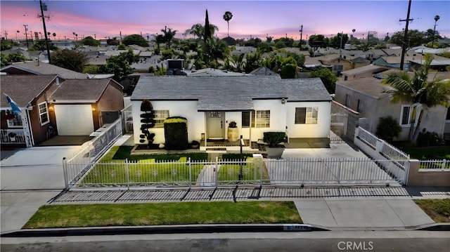 14508 S Corlett Ave, Compton, CA 90220 - view of front of property with concrete driveway, a residential view, a fenced front yard, stucco siding, and a gate