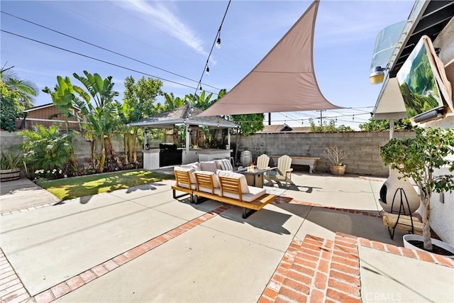 14508 S Corlett Ave, Compton, CA 90220 - fenced backyard featuring a gazebo, an outdoor living space, a patio, and an outdoor kitchen