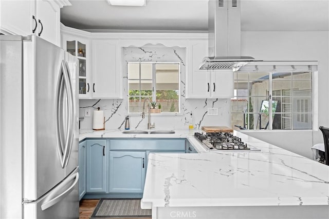 14508 S Corlett Ave, Compton, CA 90220 - kitchen with appliances with stainless steel finishes, island range hood, white cabinetry, glass insert cabinets, and dark wood-style flooring