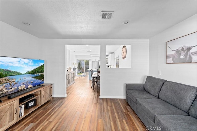 14508 S Corlett Ave, Compton, CA 90220 - living room featuring wood finished floors and baseboards