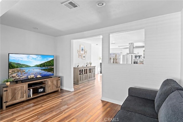 14508 S Corlett Ave, Compton, CA 90220 - living room featuring wood finished floors and baseboards