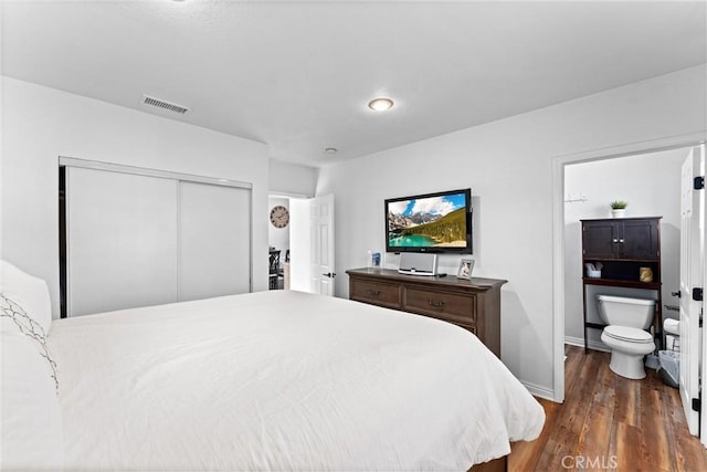 14508 S Corlett Ave, Compton, CA 90220 - bedroom with dark wood-style flooring, a closet, and ensuite bath