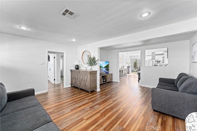 14508 S Corlett Ave, Compton, CA 90220 - living room featuring wood finished floors and recessed lighting