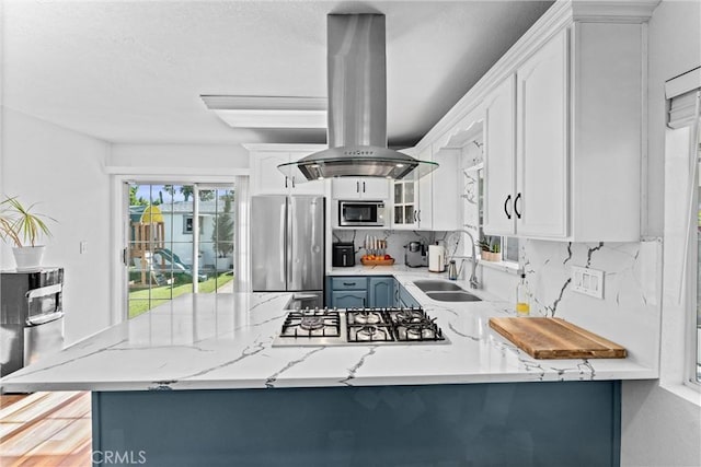 14508 S Corlett Ave, Compton, CA 90220 - kitchen with stainless steel appliances, plenty of natural light, and white cabinets