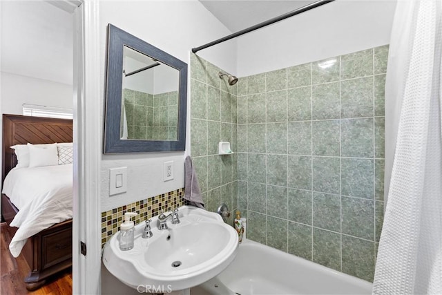 14508 S Corlett Ave, Compton, CA 90220 - bathroom with shower / bathtub combination with curtain, connected bathroom, and tasteful backsplash