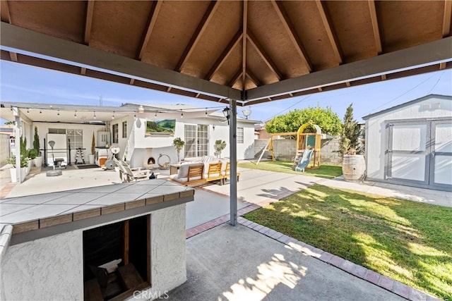 14508 S Corlett Ave, Compton, CA 90220 - view of patio / terrace with a shed, a playground, and a gazebo