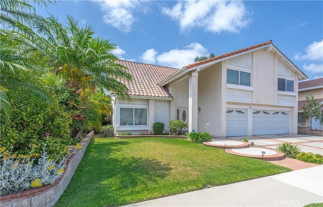 1936 W Cherry Dr, Orange, CA 92868 - view of front of home with an attached garage, a tiled roof, driveway, and a front yard
