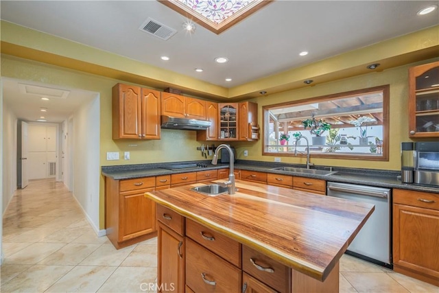 2935 Athel Dr, Hacienda Heights, CA 91745 - kitchen with dishwasher, under cabinet range hood, light tile patterned flooring, brown cabinetry, and recessed lighting