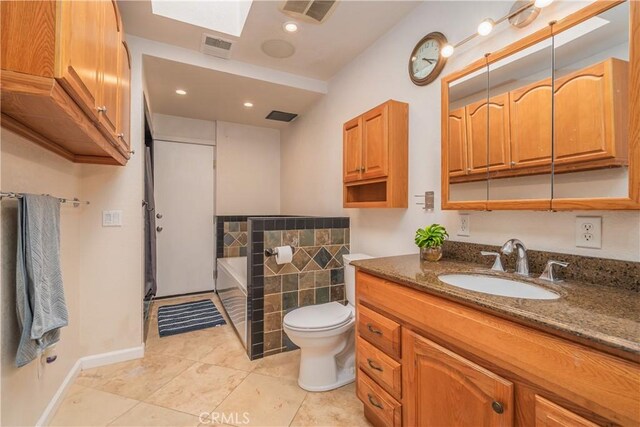 2935 Athel Dr, Hacienda Heights, CA 91745 - full bath featuring vanity, a bath, a skylight, tile patterned flooring, and recessed lighting