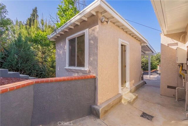 2935 Athel Dr, Hacienda Heights, CA 91745 - view of property exterior featuring stucco siding and a patio area
