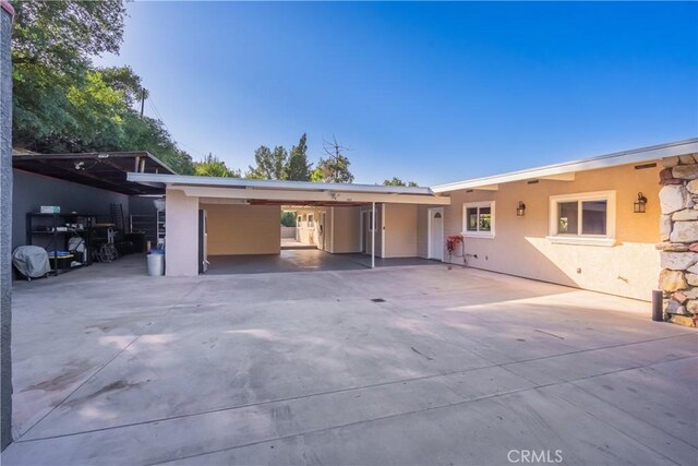 2935 Athel Dr, Hacienda Heights, CA 91745 - ranch-style house featuring stucco siding, a carport, and driveway