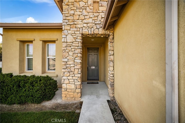 35668 Trevino Trl, Beaumont, CA 92223 - doorway to property with stone siding and stucco siding