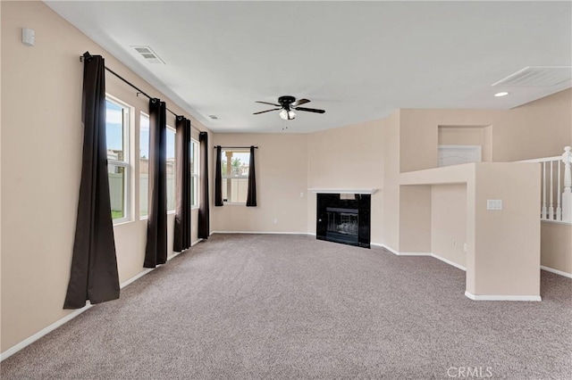 35668 Trevino Trl, Beaumont, CA 92223 - unfurnished living room with carpet floors, a ceiling fan, a fireplace with flush hearth, and recessed lighting