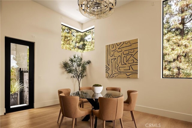 1955 Curson Pl, Los Angeles, CA 90046 - dining area featuring a chandelier and light wood finished floors
