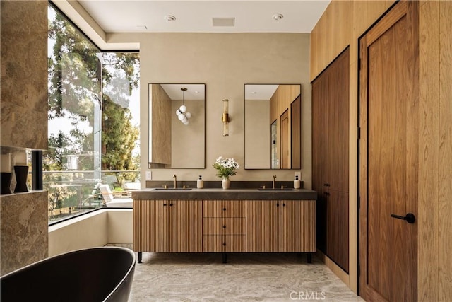 1955 Curson Pl, Los Angeles, CA 90046 - bathroom featuring a soaking tub, double vanity, and healthy amount of natural light