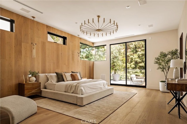 1955 Curson Pl, Los Angeles, CA 90046 - bedroom with wooden walls, access to exterior, and wood finished floors