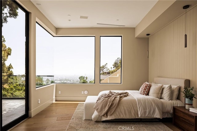 1955 Curson Pl, Los Angeles, CA 90046 - bedroom featuring wood finished floors and access to outside