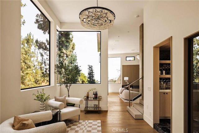 1955 Curson Pl, Los Angeles, CA 90046 - living area featuring wood finished floors and a chandelier