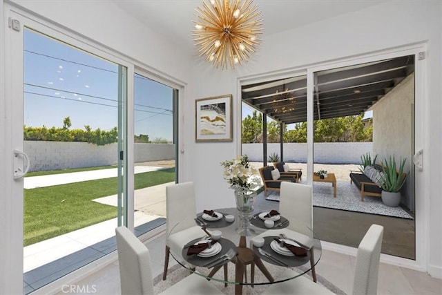 2002 N Whitewater Club Dr N, Palm Springs, CA 92262 - dining area with a chandelier and plenty of natural light