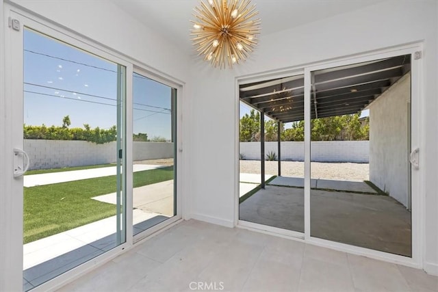 2002 N Whitewater Club Dr N, Palm Springs, CA 92262 - entryway with a chandelier and plenty of natural light