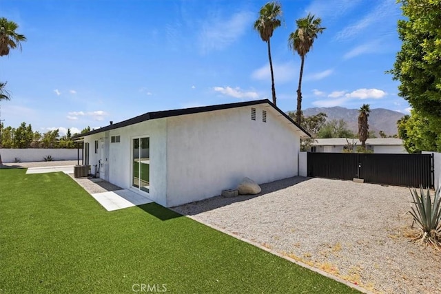 2002 N Whitewater Club Dr N, Palm Springs, CA 92262 - rear view of property featuring stucco siding and a mountain view