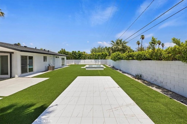 2002 N Whitewater Club Dr N, Palm Springs, CA 92262 - fenced backyard featuring a patio and an in-ground hot tub