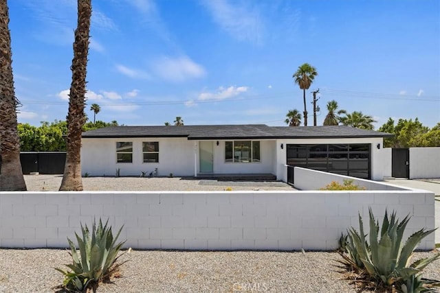2002 N Whitewater Club Dr N, Palm Springs, CA 92262 - single story home featuring an attached garage, stucco siding, and concrete driveway