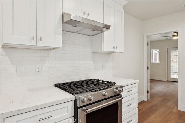 2141 Sierra Way, San Luis Obispo, CA 93401 - kitchen with under cabinet range hood, gas stove, light wood-style flooring, and white cabinets