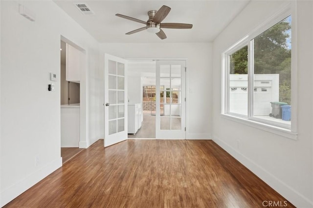 2141 Sierra Way, San Luis Obispo, CA 93401 - spare room with french doors, wood finished floors, and a ceiling fan