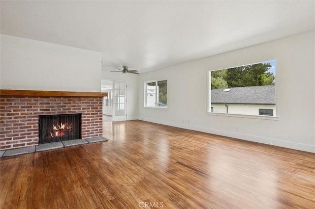2141 Sierra Way, San Luis Obispo, CA 93401 - unfurnished living room with wood finished floors, a brick fireplace, and a ceiling fan