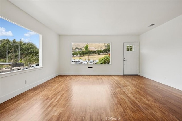 2141 Sierra Way, San Luis Obispo, CA 93401 - unfurnished living room featuring wood finished floors and baseboards