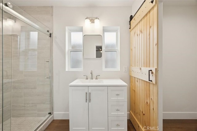 2141 Sierra Way, San Luis Obispo, CA 93401 - full bathroom featuring vanity, a stall shower, and wood finished floors