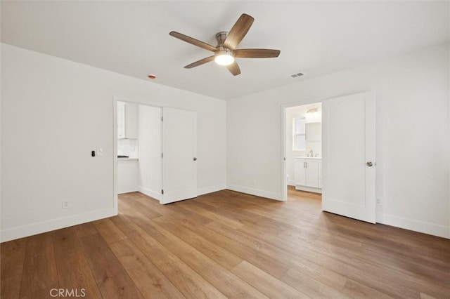 2141 Sierra Way, San Luis Obispo, CA 93401 - unfurnished bedroom featuring light wood-type flooring, connected bathroom, and ceiling fan