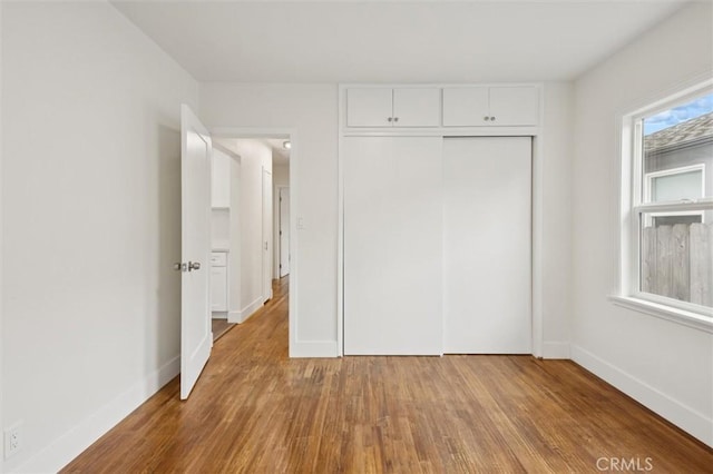 2141 Sierra Way, San Luis Obispo, CA 93401 - unfurnished bedroom with wood finished floors and a closet