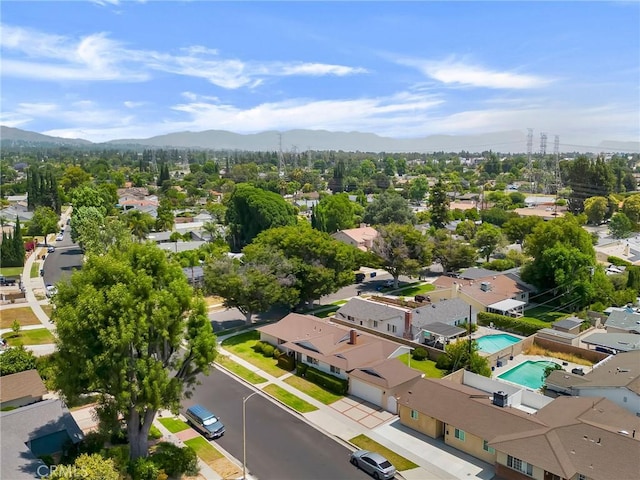18944 Prairie St, Northridge, CA 91324 - aerial perspective of suburban area with a mountain backdrop and a pool