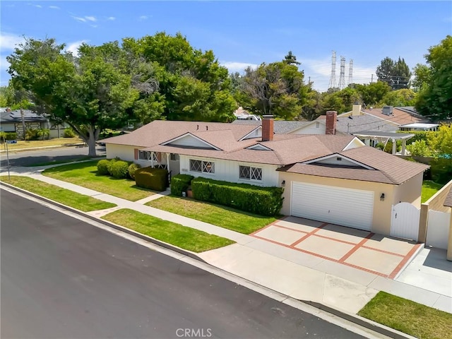 18944 Prairie St, Northridge, CA 91324 - single story home featuring an attached garage, driveway, a gate, roof with shingles, and a chimney