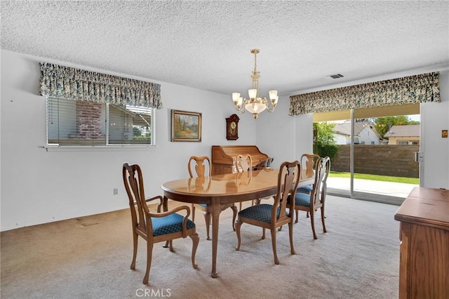 18944 Prairie St, Northridge, CA 91324 - dining room featuring a chandelier, carpet flooring, and a textured ceiling